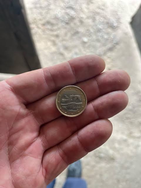 Photo placeholder: January 1, 2002. Italy gets the euro. My mother sends me to buy bread with a new coin